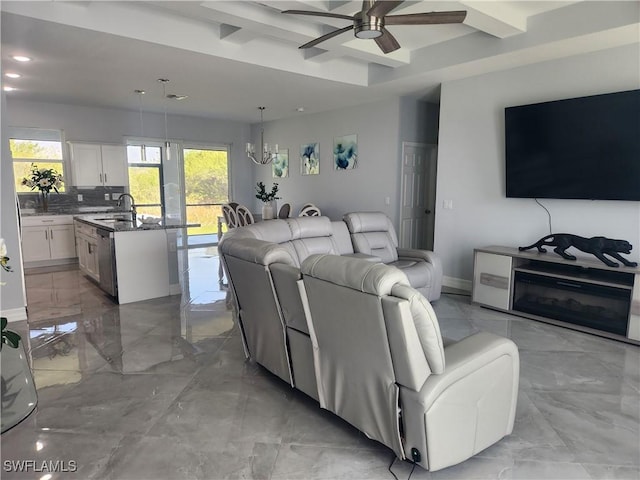 living room with recessed lighting, baseboards, marble finish floor, and ceiling fan with notable chandelier