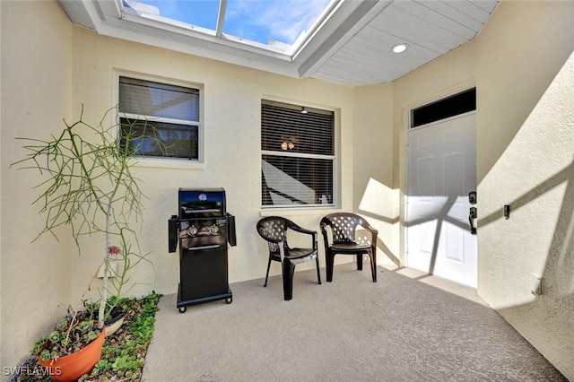 entrance to property with stucco siding