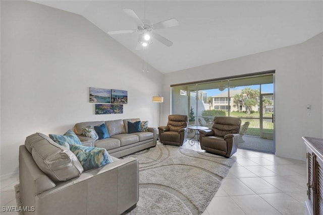 living area with ceiling fan, high vaulted ceiling, and light tile patterned flooring