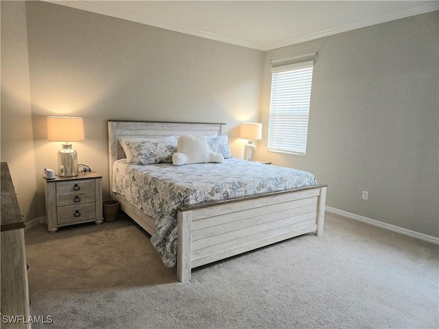 carpeted bedroom with baseboards and ornamental molding