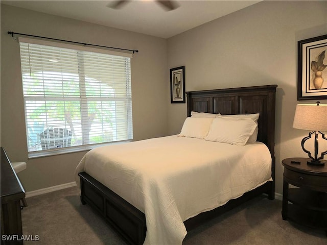 bedroom featuring carpet flooring and baseboards