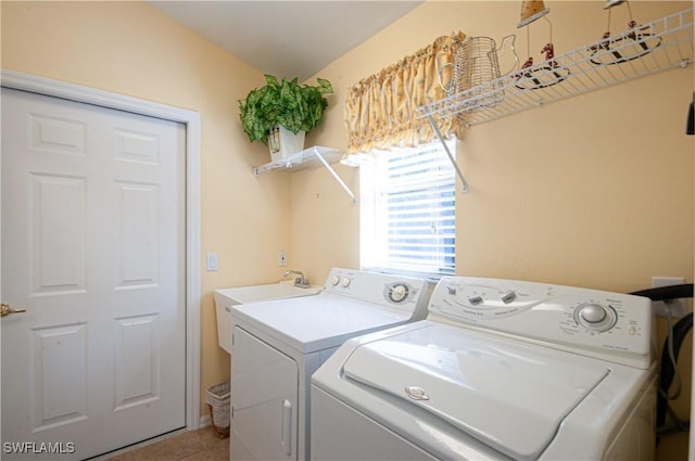 laundry area with laundry area, light tile patterned floors, and separate washer and dryer