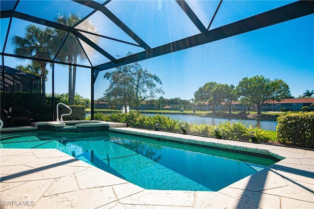 view of pool with a water view, a pool with connected hot tub, a lanai, and a patio area