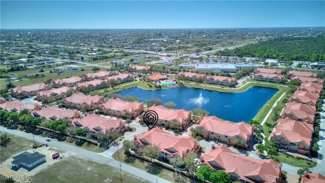 birds eye view of property with a residential view and a water view