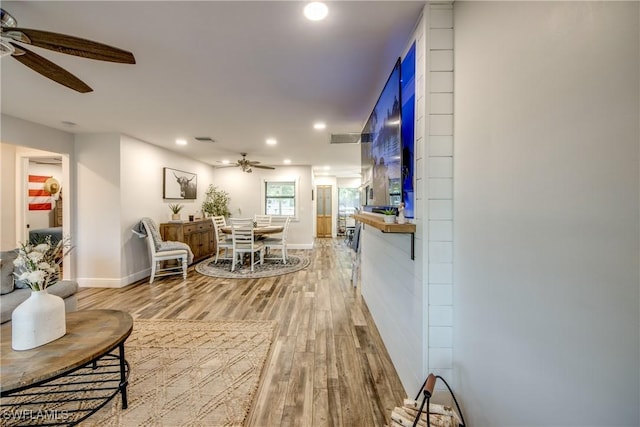 618 SE 26th St, Cape Coral, FL 33904 - living room with ceiling fan, light wood-style floors, recessed lighting, and baseboards