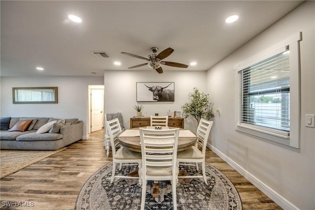 618 SE 26th St, Cape Coral, FL 33904 - dining room featuring wood finished floors, ceiling fan, recessed lighting, plenty of natural light, and baseboards