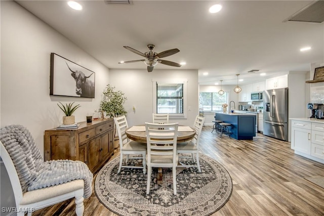 618 SE 26th St, Cape Coral, FL 33904 - dining room featuring light wood-type flooring, a ceiling fan, and recessed lighting