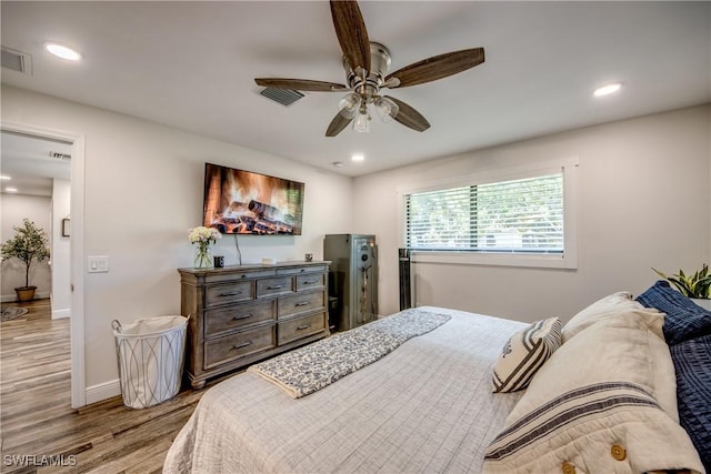 618 SE 26th St, Cape Coral, FL 33904 - bedroom featuring wood finished floors, recessed lighting, baseboards, and ceiling fan