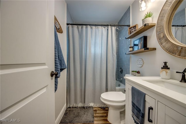 618 SE 26th St, Cape Coral, FL 33904 - full bathroom featuring toilet, vanity, wood finished floors, and shower / tub combo with curtain