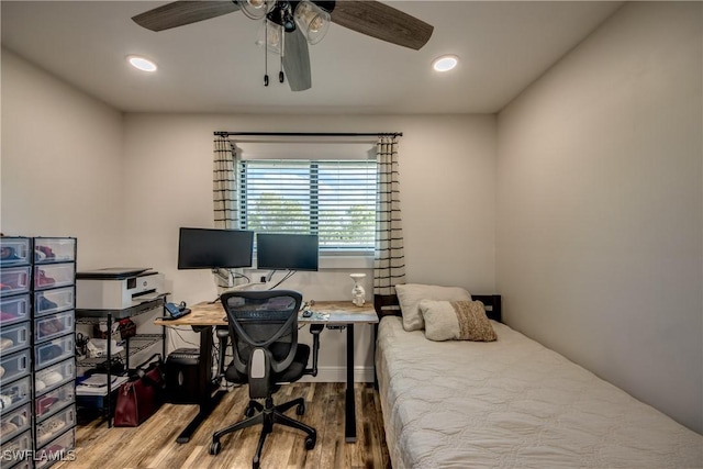 618 SE 26th St, Cape Coral, FL 33904 - bedroom featuring wood finished floors, an office area, recessed lighting, and a ceiling fan