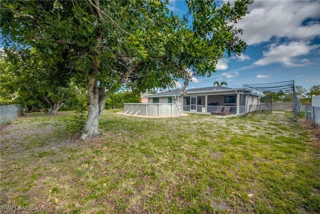 618 SE 26th St, Cape Coral, FL 33904 - view of yard with a sunroom