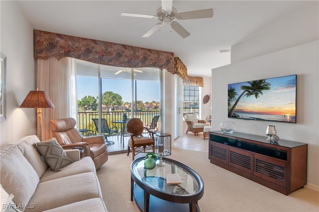 living room with carpet flooring and a ceiling fan