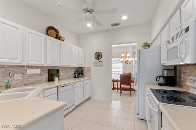 kitchen with visible vents, light tile patterned floors, white appliances, white cabinetry, and a sink