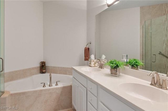 full bath featuring a sink, a stall shower, a bath, and double vanity