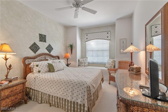 carpeted bedroom with a ceiling fan