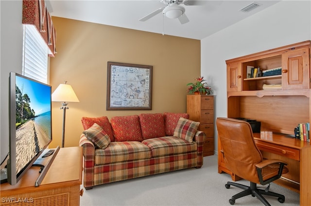 office featuring visible vents, carpet floors, and ceiling fan