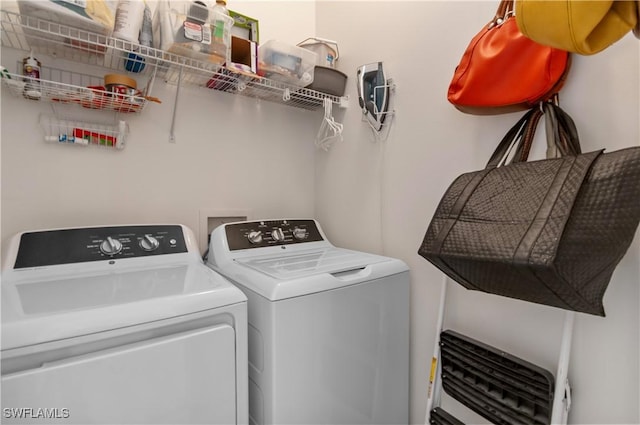 laundry area featuring laundry area and washer and clothes dryer