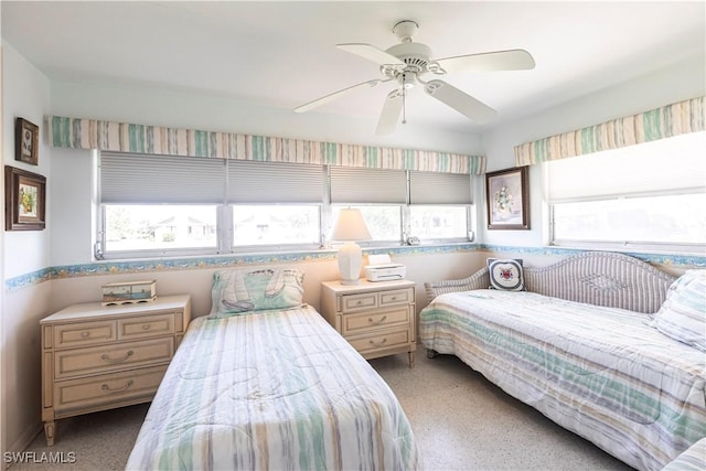 bedroom with multiple windows and ceiling fan