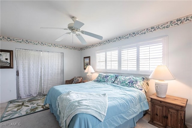 carpeted bedroom featuring a ceiling fan