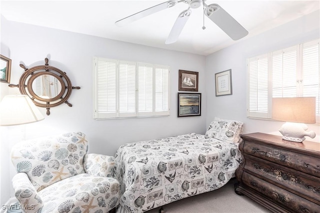 bedroom with ceiling fan and carpet