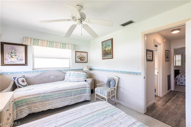 bedroom with visible vents, a ceiling fan, and baseboards