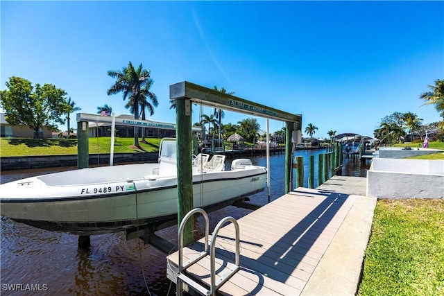 view of dock featuring a water view and boat lift