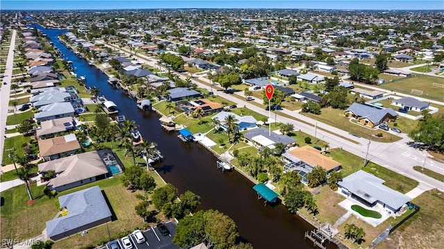 aerial view with a residential view and a water view