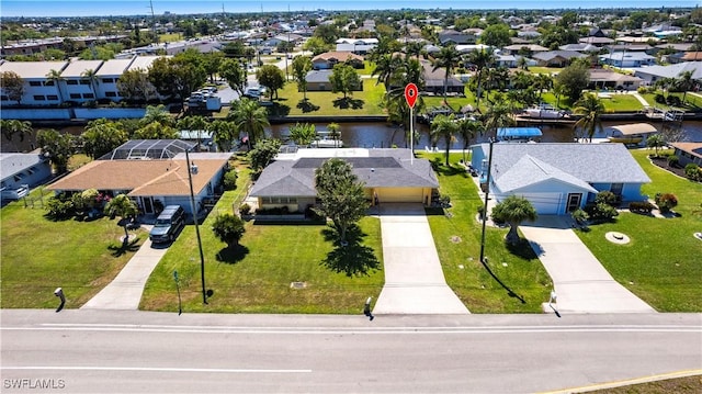 aerial view with a residential view and a water view