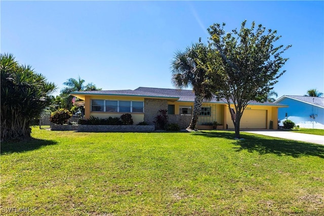 ranch-style home featuring stucco siding, an attached garage, concrete driveway, and a front yard