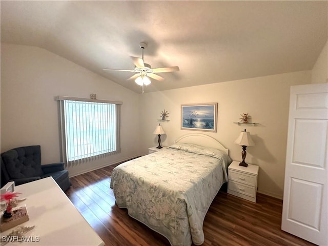 bedroom with lofted ceiling, baseboards, dark wood finished floors, and a ceiling fan