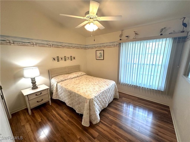 bedroom with baseboards, a ceiling fan, vaulted ceiling, and dark wood-style flooring