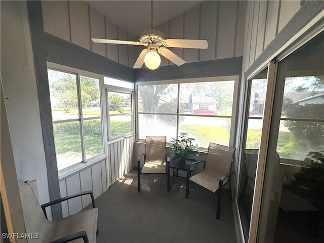 sunroom / solarium featuring vaulted ceiling and a ceiling fan