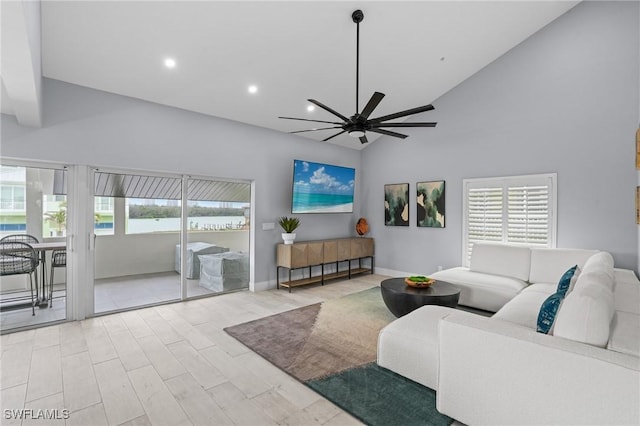 living area featuring high vaulted ceiling, a ceiling fan, wood finished floors, recessed lighting, and baseboards