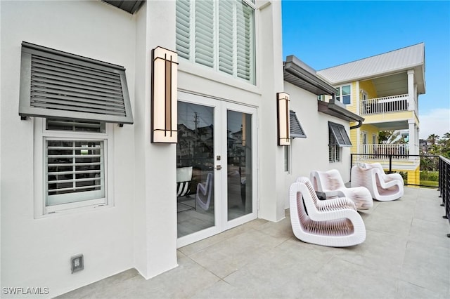 view of patio with wine cooler and french doors