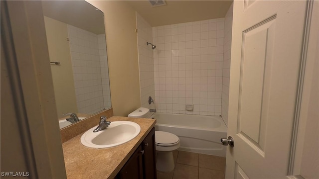 full bathroom with bathtub / shower combination, toilet, visible vents, vanity, and tile patterned floors