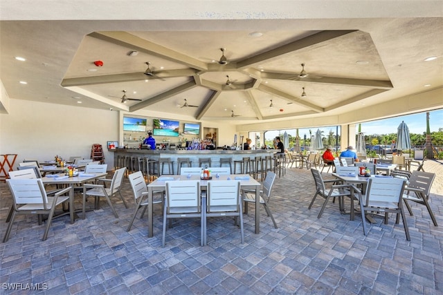 view of patio featuring outdoor dining area and ceiling fan