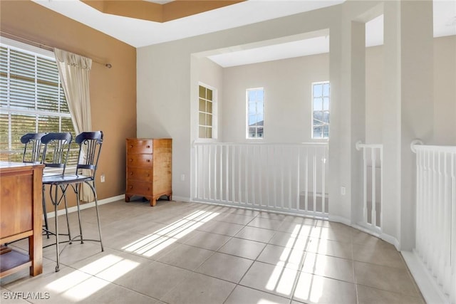 17498 Old Harmony Dr Unit 202, Fort Myers, FL 33908 - unfurnished room with tile patterned flooring, plenty of natural light, radiator heating unit, and baseboards