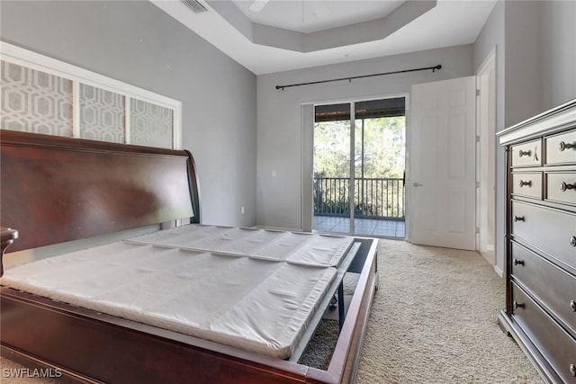 17498 Old Harmony Dr Unit 202, Fort Myers, FL 33908 - carpeted bedroom with a tray ceiling, visible vents, and access to exterior