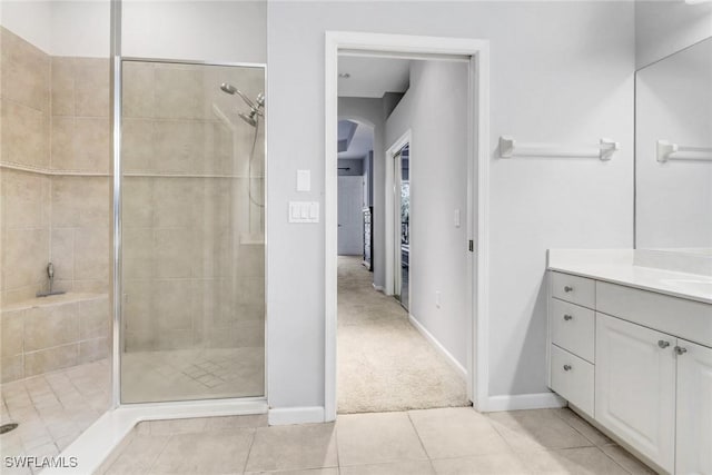 17498 Old Harmony Dr Unit 202, Fort Myers, FL 33908 - full bathroom featuring tile patterned floors, a shower stall, vanity, and baseboards