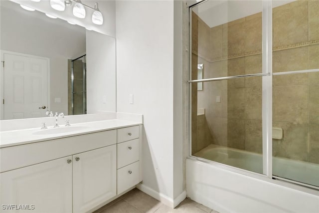 17498 Old Harmony Dr Unit 202, Fort Myers, FL 33908 - bathroom featuring tile patterned flooring, vanity, baseboards, and bath / shower combo with glass door
