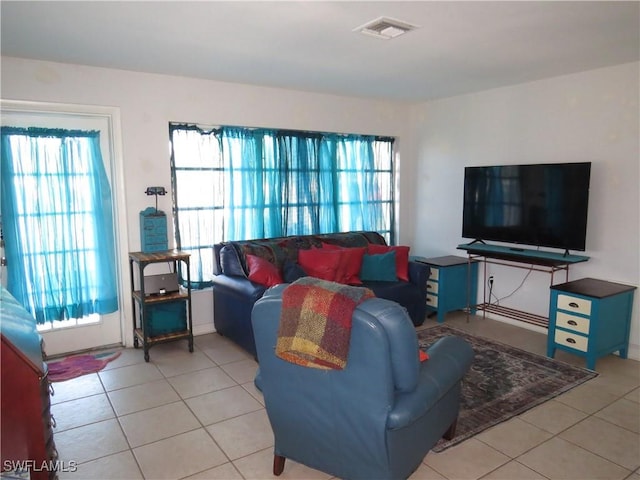 living room with visible vents and light tile patterned flooring