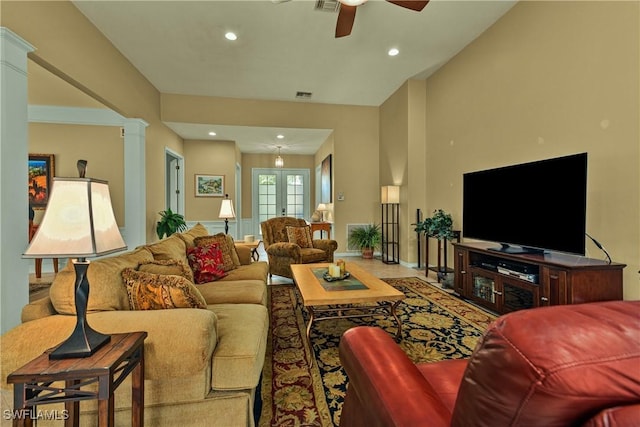 living area featuring recessed lighting, french doors, a ceiling fan, and decorative columns