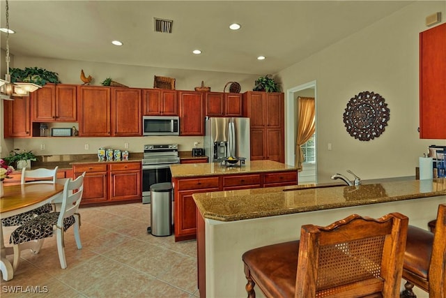 kitchen featuring visible vents, recessed lighting, appliances with stainless steel finishes, light tile patterned flooring, and a sink