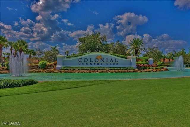 community / neighborhood sign featuring a lawn