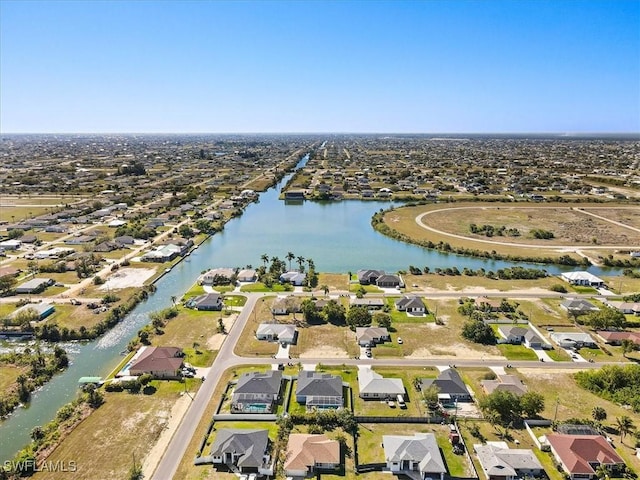 aerial view featuring a residential view and a water view