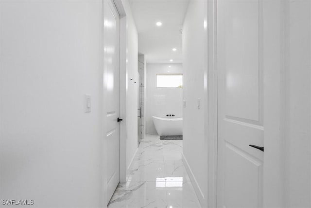 hall featuring recessed lighting, marble finish floor, and baseboards