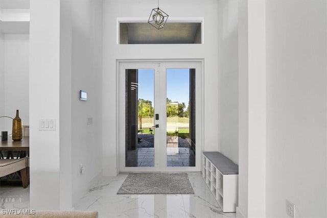 entryway with marble finish floor