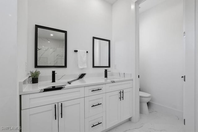 full bathroom featuring toilet, marble finish floor, a sink, a marble finish shower, and double vanity