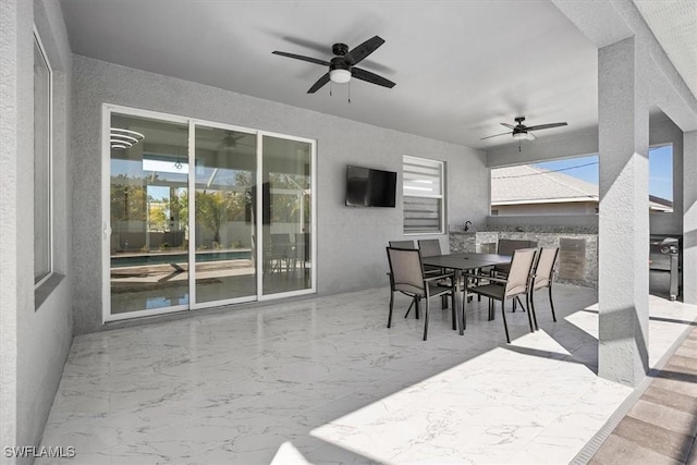 view of patio / terrace featuring outdoor dining space and ceiling fan