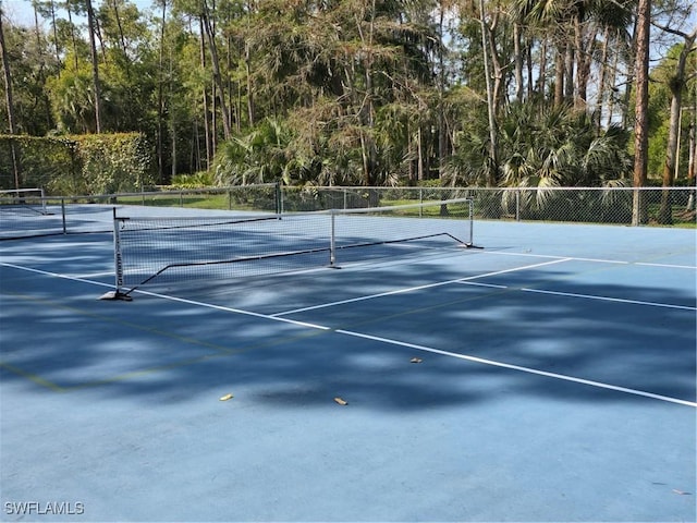 view of sport court with fence